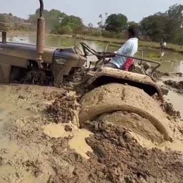 Tractor Stuck in Muddy Waters