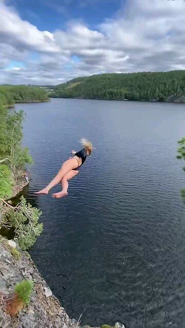 Girl jumping in the river