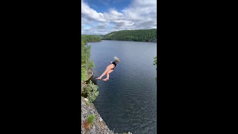 Girl jumping in the river