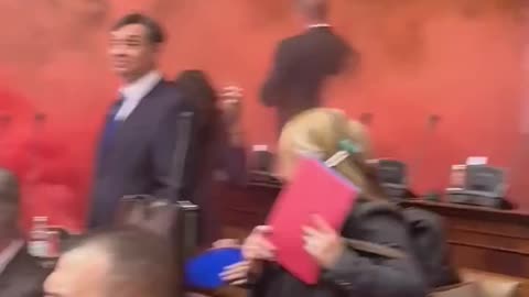 Pure Chaos in Serbian Parliament As Opposition Protesters Set Off Smoke Grenades