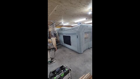 Inflatable paint booth in a small shop