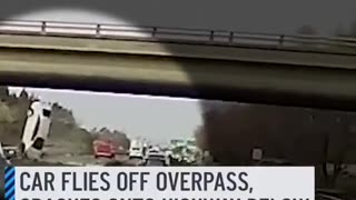 car flies off an overpass and lands on a busy highway