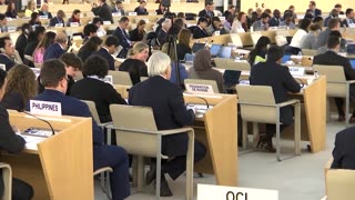 Delegates walk out during Russia's speech to UN rights council