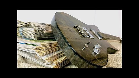 Building a Guitar Out of 700 Sheets of Newspaper