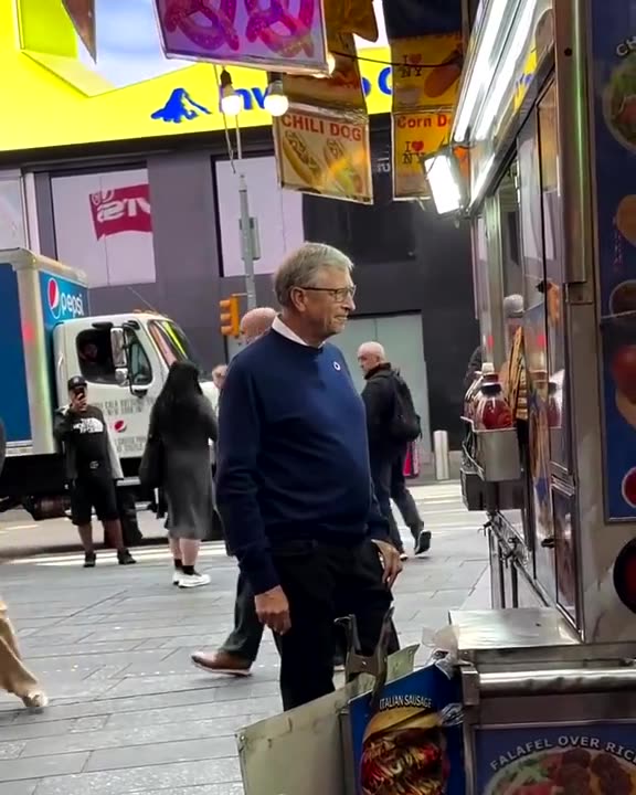Bill Gates in public trying to look human............. doesnt even eat the hotdog