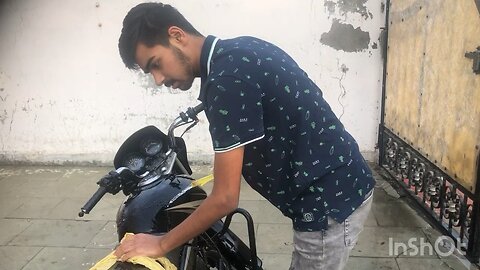 Rajveer washing motorcycle