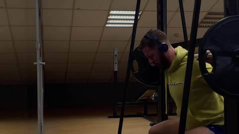 Squat on the lat machine