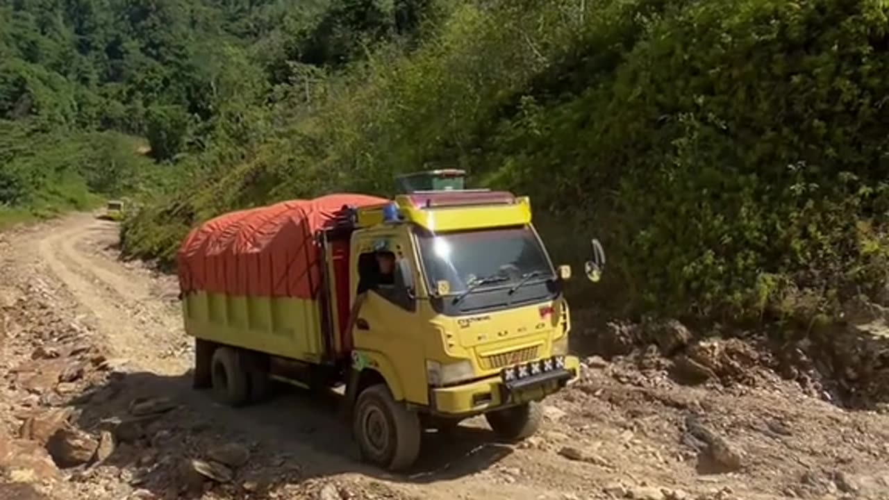 the action of a young driver over a steep, sharp incline