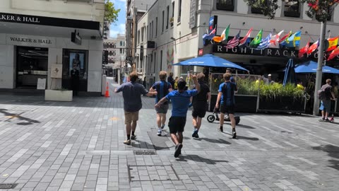 Wokington Phoenix fans exchange pleasantries with Auckland F.C. supporters in downtown Auckland.