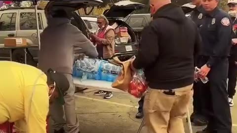 A hot dog vendor was feeding the firefighters out of the kindness of his heart