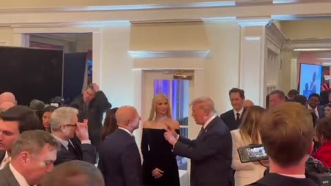 President Trump and Jeff Bezos are talking at Trump National Golf Club.