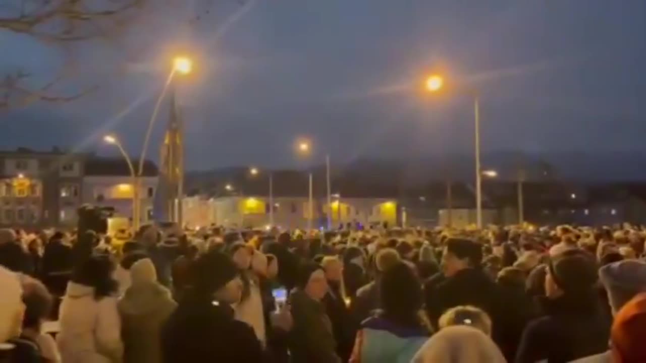 Church bells ring. People mourn Alex (14) who was stabbed to death by an Afghan in Villach, Austria.