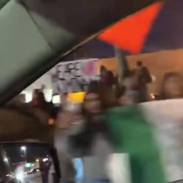 Illegal migrants stage a protest against mass deportations as they wave foreign