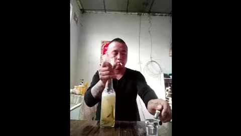 Man Chugs Alcohol w/Worms/Slugs/Eels (Not Sure What They Are...)