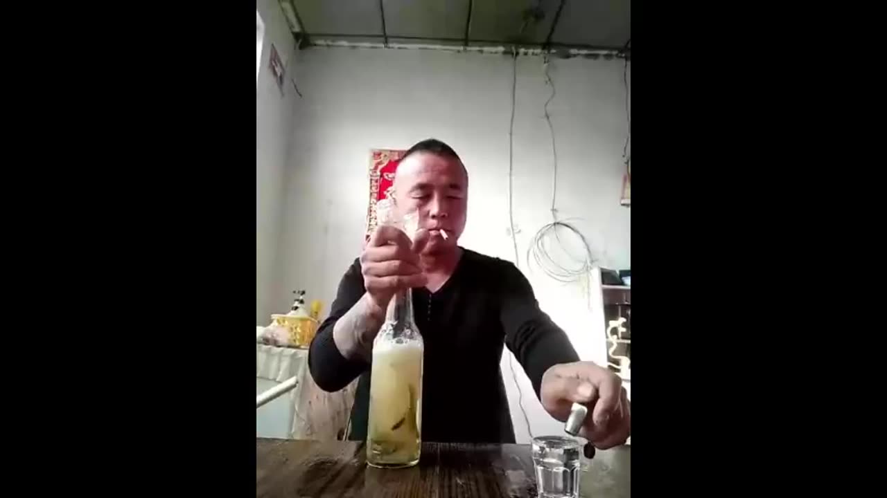 Man Chugs Alcohol w/Worms/Slugs/Eels (Not Sure What They Are...)