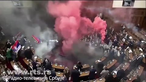 Chaos in Serbian parliament as opposition sets off smoke grenades to protest against the government.