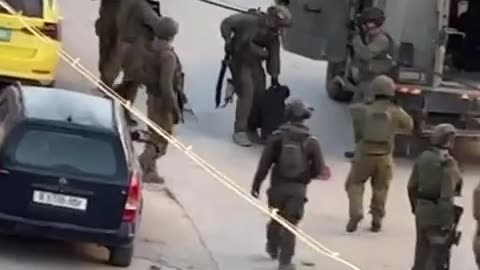 Israeli occupation soldiers drag and abuse a young man