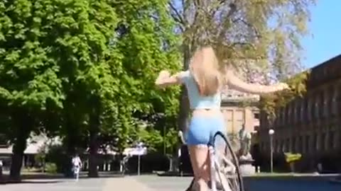 A sexy girl's bicycle trick