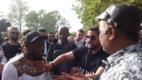 Speakers Corner - Uncle Sam talks to Lamin who comes to Help Muslims defend the