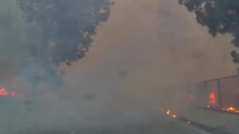 Watch as citizen journalist FirePhotoGirl rescues a woman fleeing for her life