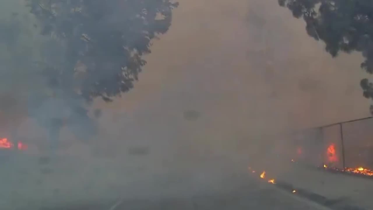 Watch as citizen journalist FirePhotoGirl rescues a woman fleeing for her life