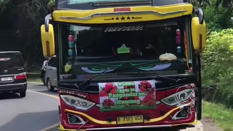 This girl was given a gift by several passing tourist buses