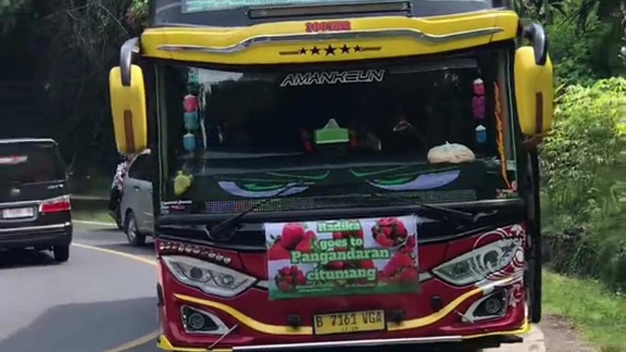 This girl was given a gift by several passing tourist buses