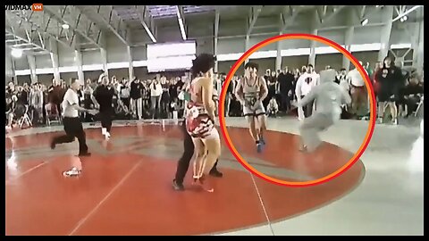 College Wrestler Is A Terrible Sport As He Sucker-Punches His Opponent After Losing To Him