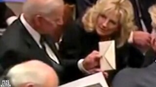 Jill Biden hands Joe the note. What is this? Biden is confused. They don’t know where this came from