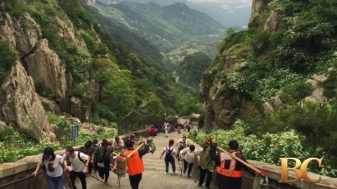 Robotic exoskeletons help Chinese tourists climb the country’s most punishing mountain