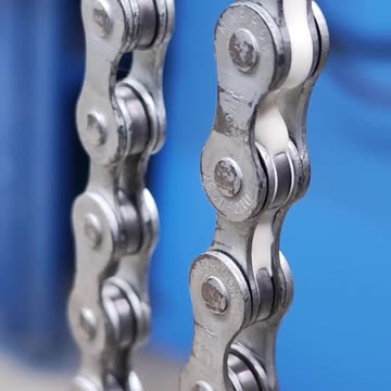 Bicycle chain with a drop of paraffin grease