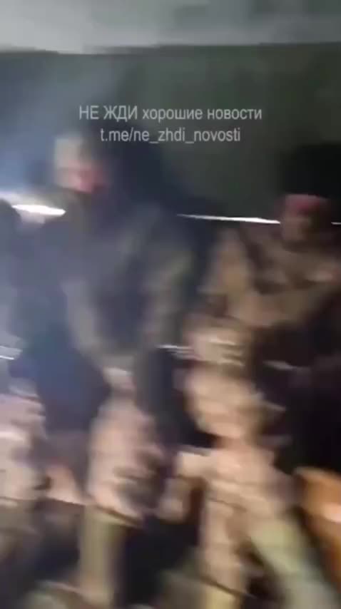 10 Russians Cuffed to 3 Ukrainians for Transport to Kyiv