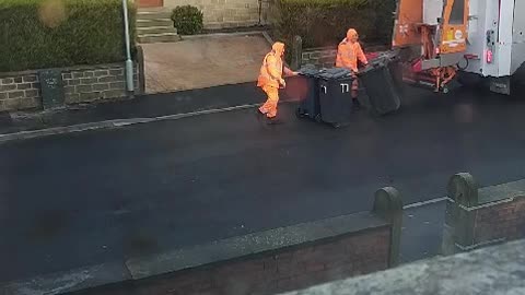 Rat Jumps Out of Bin and Startles Garbage Man