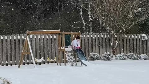 Little Girl Takes A Tumble Sliding Into Snow