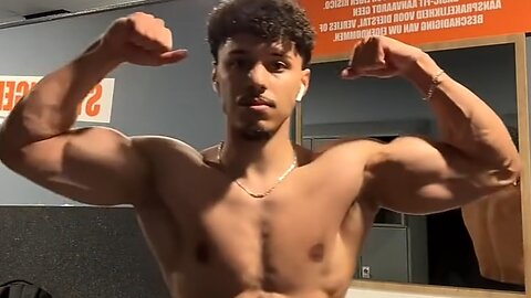 Young bodybuilder flexing muscles
