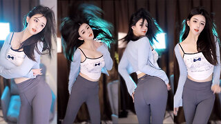 Pure looking dancer in tight yoga pants, playful waist twists and a flirty pose