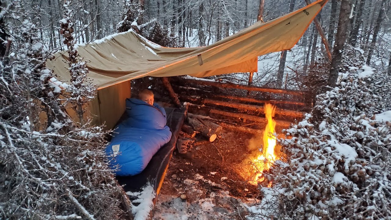 Winter Camping in Snow Storm with Survival Shelter & Bushcraft Cot.WinterCamping #SnowStorm #Surviva