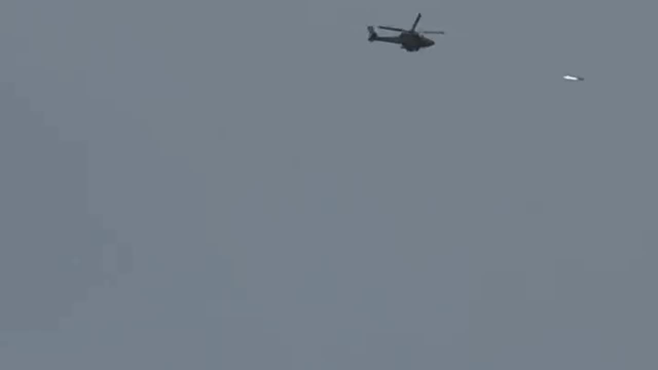 An Israeli military helicopter fires a missile on the north of Gaza