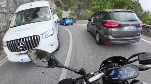 Motorcycle Overtakes Midturn and Loses Control