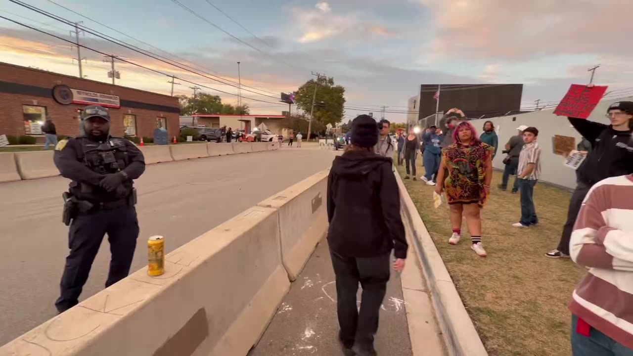 Unhinged leftist screams at police.