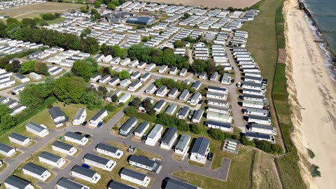 Flying DJI Mini 4 Pro Drone at windy Broadland Sands Holiday Park Lowestoft 2025