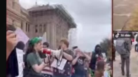 Protestor Reads a Poem