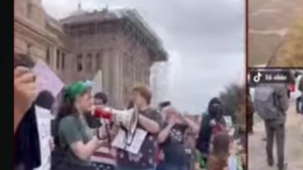 Protestor Reads a Poem