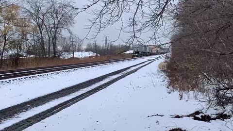 Lone CSX engine 809 hauls a train West