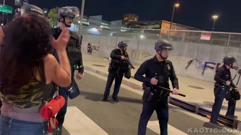 Fugly Tranny Rides Into LAPD Riot Control Cops