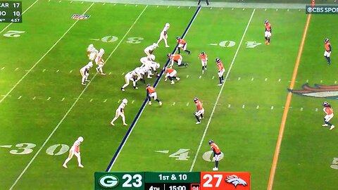 Packers RB #8 Josh Jacobs gets licked by the Broncos linebacker