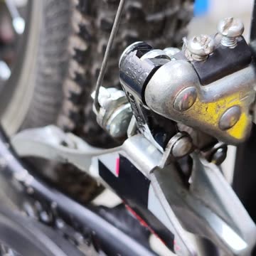 I applied grease to the front derailleur of my bike, made some adjustments, and it works fine