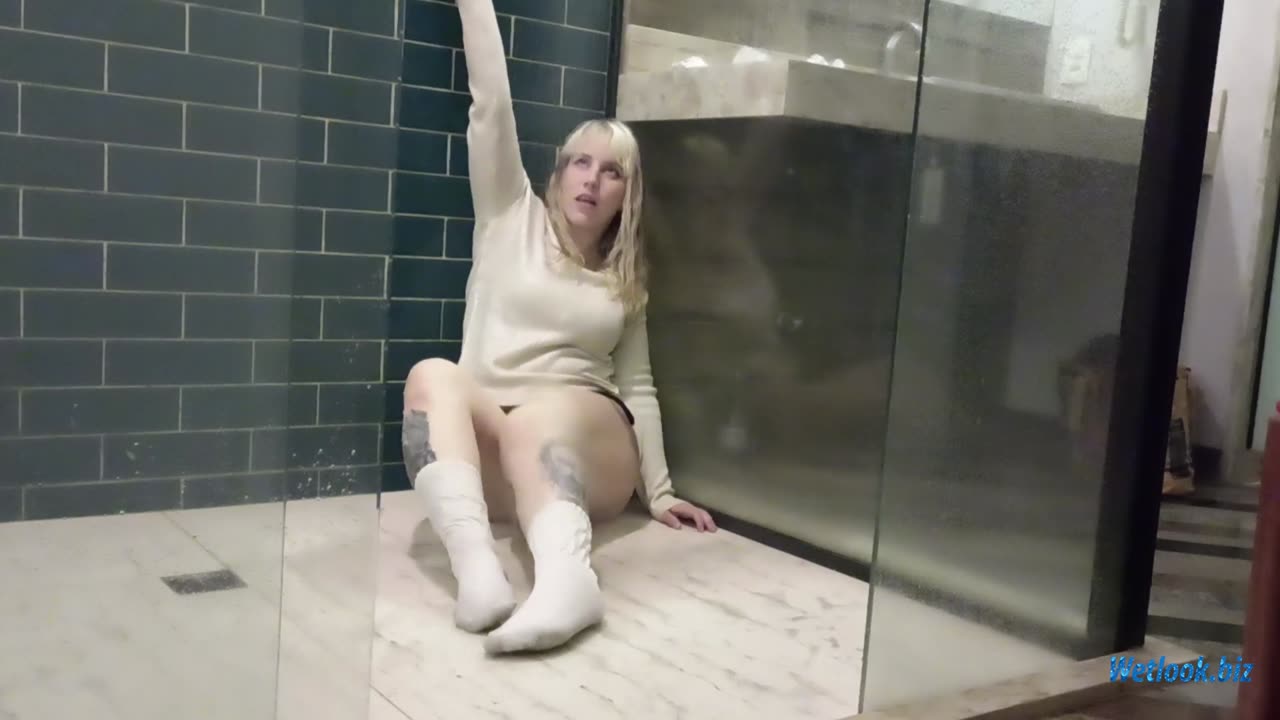 Wetlook girl dressed in a cozy sweater