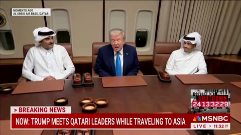Trump meets Emir of Qatar on Air Force One.