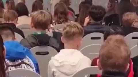 Young white German school kids forced to listen to a muslim sing to ALLAH